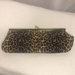Leopard black and brown print fabric clutch bag with gold chain and kiss lock.